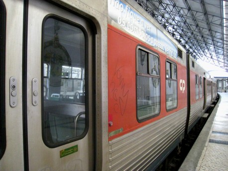 Inside Rossio station, Lisbon, with some lovely azulejo tiles reflected in the window of the train